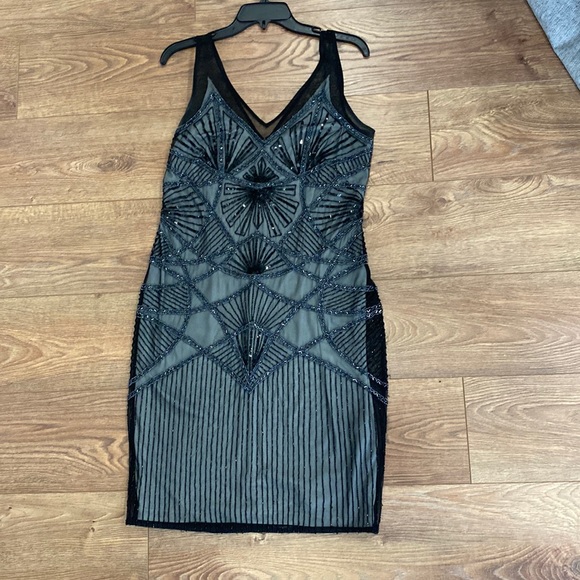 Size 10 lined beaded just above the knee cocktail dress. - Picture 1 of 7